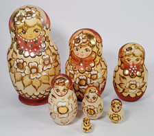 7 Piece Floral Russian Matryoshka Wood Nesting Dolls. Brown, Gold Accented.