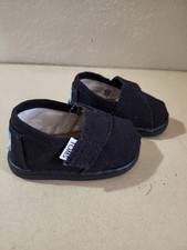 Black TOMS toddler slip-on shoes, size 3