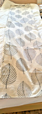 Dunelm a pair of eyelet curtains with a leaf motif used