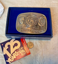 SMITH  WESSON MODEL 610 ANTIQUE SILVER BELT BUCKLE 125 YEAR ANNIVERS 1977. NIB