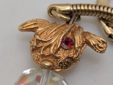 Gold Toned Dog with Plastic Body and Red Eye Keychain Accessory