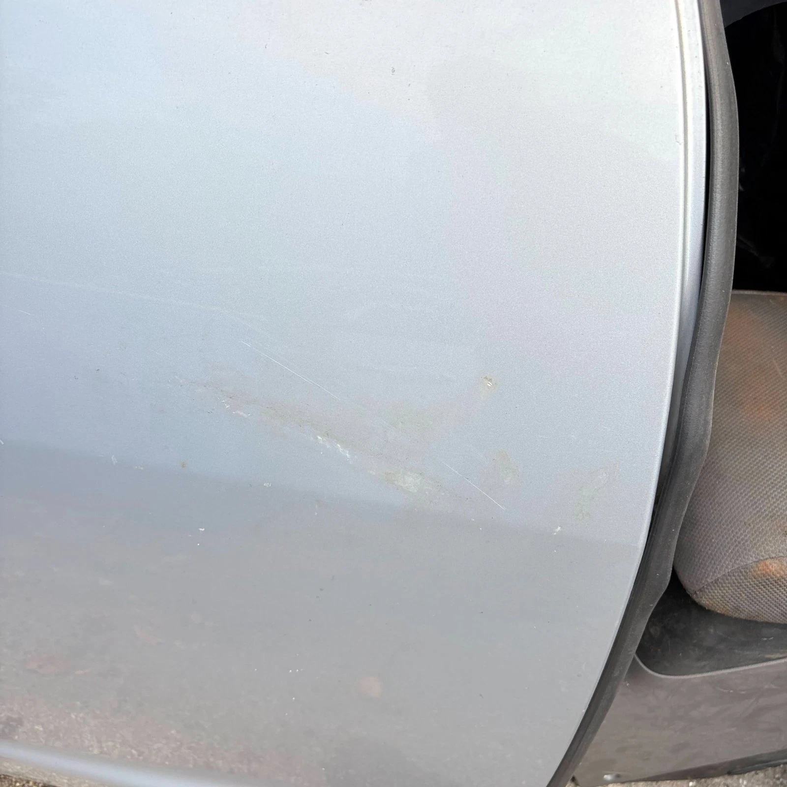 Jaguar XF rear right door visible scratches and storage marks