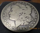 1887-O Morgan Silver Dollar – New Orleans Mint – 90% Silver – Heavily Circulated