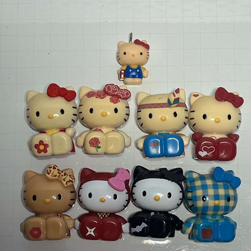 A set of 8 vintage retro Hello Kitty mini figures from Japan — the kind of rare Sanrio nostalgia that serious collectors hunt for.
