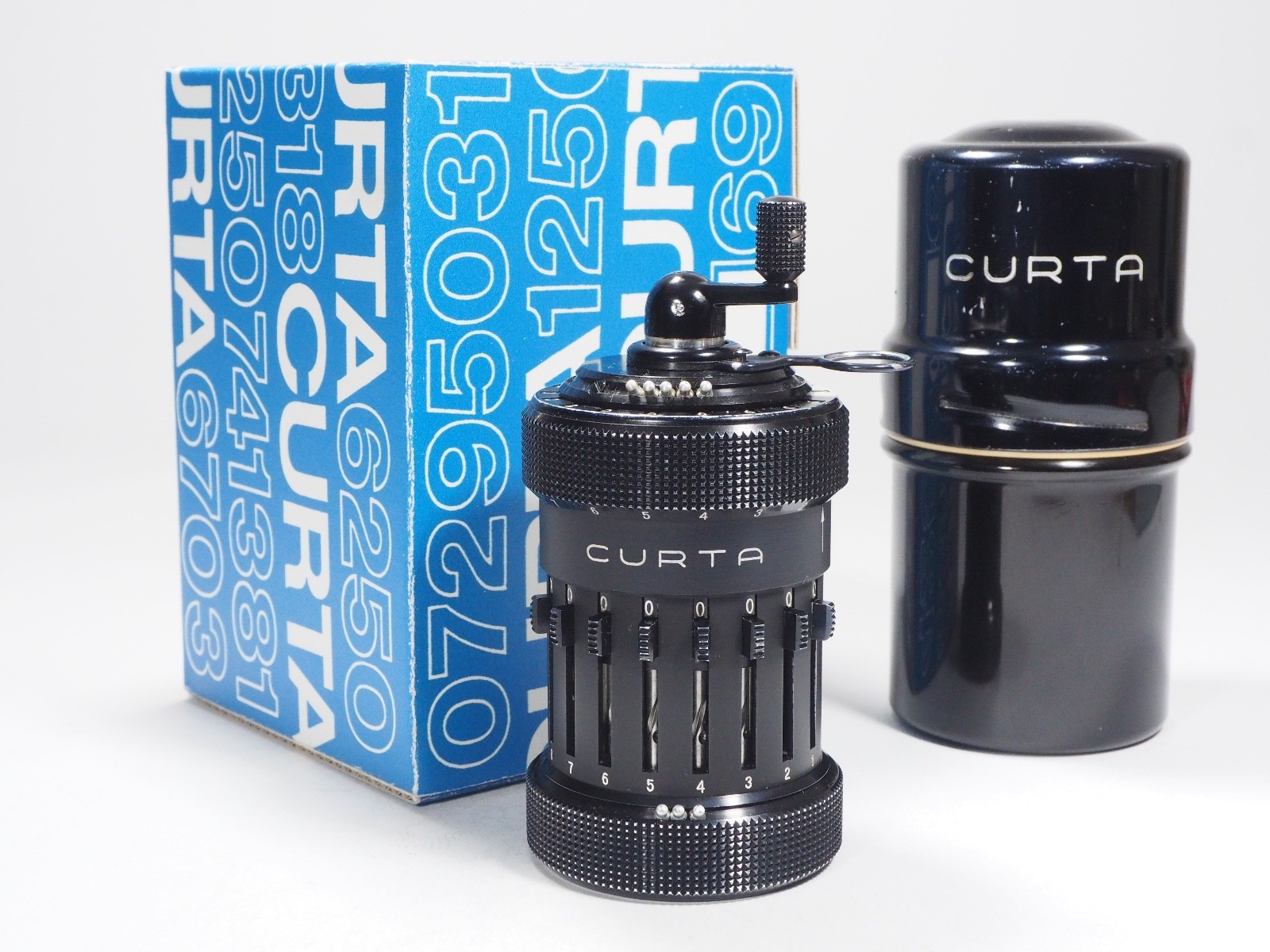 Curta Calculator 1954 Type 1 all metal w/can, box, 3 manuals, perfect function