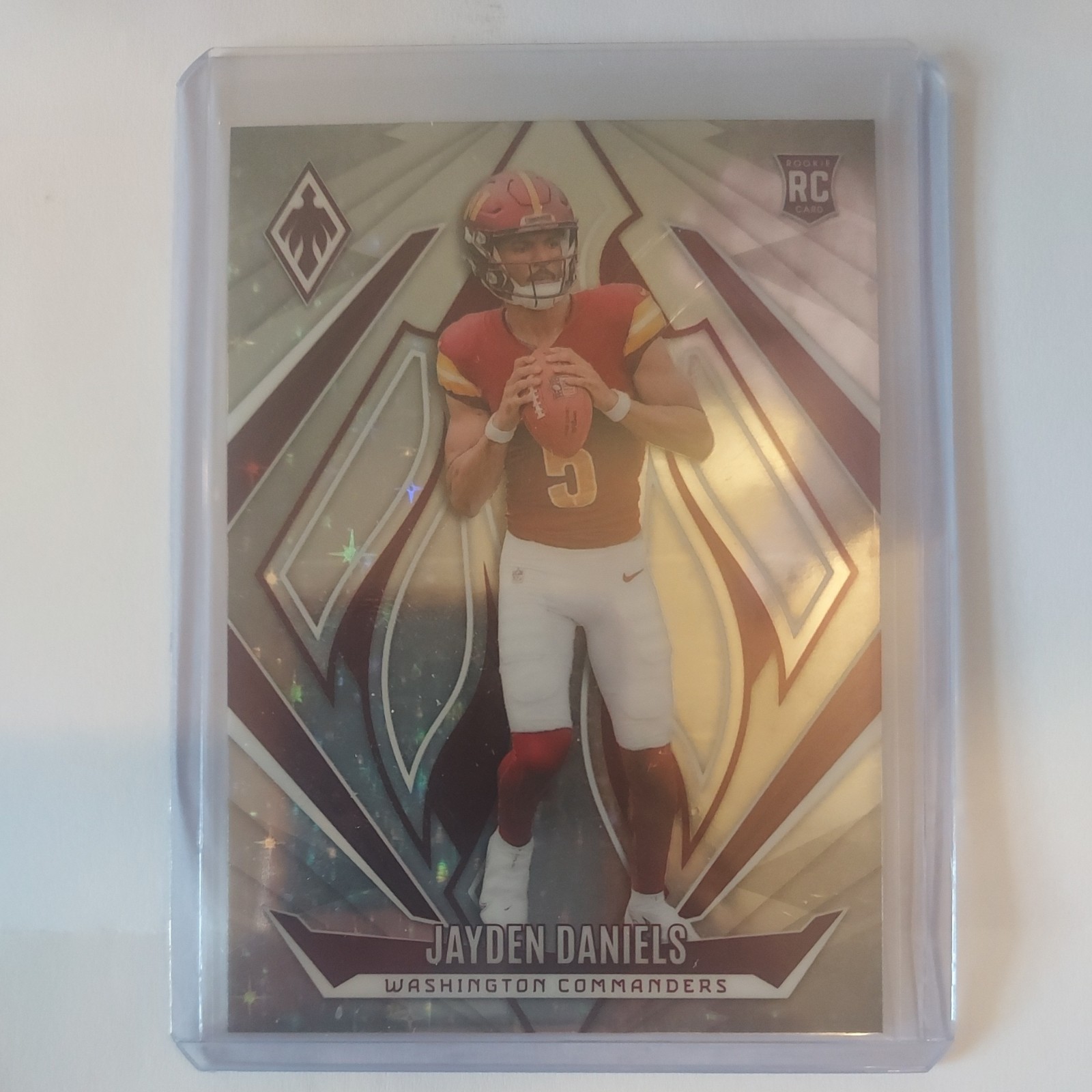 2024 Panini Phoenix - Rookies Jayden Daniels #198 Stars /180 (RC)