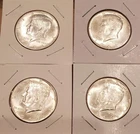 Four 1964 Kennedy half dollars