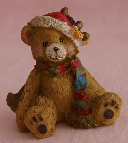 christmas winter bear sitting wearing santa hat and multi