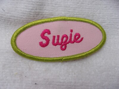 SUZIE  USED EMBROIDERED  SEW ON NAME PATCH TAG OVAL OLIVE WITH PINK ON PINK