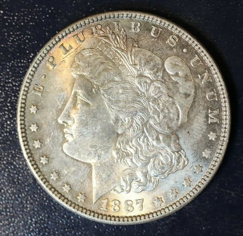 1887-P MORGAN SILVER DOLLAR - UNCIRCULATED, TONED - L9K38