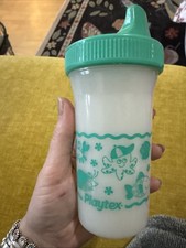 vintage Playtex sippy cup featuring a green lid and a sea life graphic design