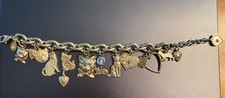 Pulsera Kirks Folly Cat vintage años 90 diamantes de imitación tono dorado 12 dijes