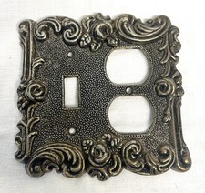 1973 American Tack & Hardware Co ornate metal double switch plate cover