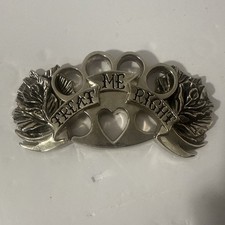 Vintage Treat Me Right" belt buckle by the brand Rock Rebel Size 3 x 5 Inches