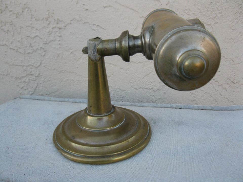 A patented 1879 antique brass student lamp that converts between desk and wall mount — it's a working piece of 19th-century engineering you can actually use.