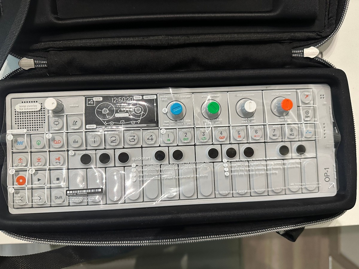 OP-1 Synthesizer with a case