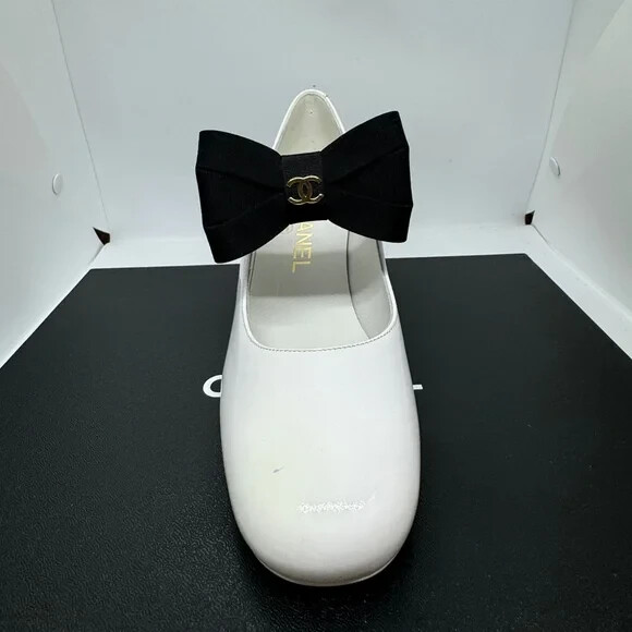 Chanel Women's Interlocking CC Logo Mules White with Black Bow