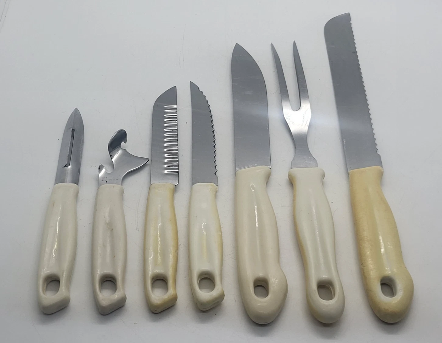 Vintage cutlery set: various knives, vegetable peeler, large fork, USSR
