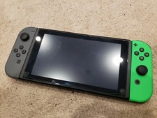Nintendo Switch with soft, hard, and carrying case - green and black joycons