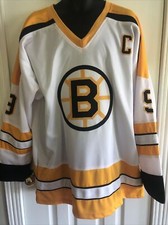 Johnny Bucyk Autographed Bruins Jersey And Card
