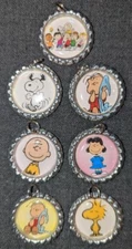 Set of 7 Peanuts Charlie Snoopy Bottle Caps Bling Charms Split Rings Crafts DIY