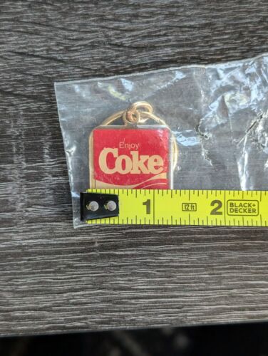 VINTAGE ENJOY COKE COCA~COLA RED GOLD TONE KEYCHAIN 1.25" x 1.25" - SEALED RARE - Picture 3 of 4