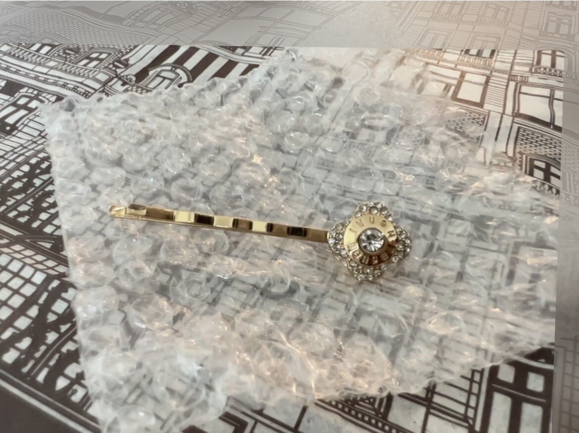 Henri Bendel Hair Pins. Yellow gold color and crystal color 