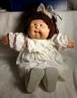 1985 Cabbage Patch Doll, Brown yarn Hair, Ponytail, Amethyst Eyes, Dimple.