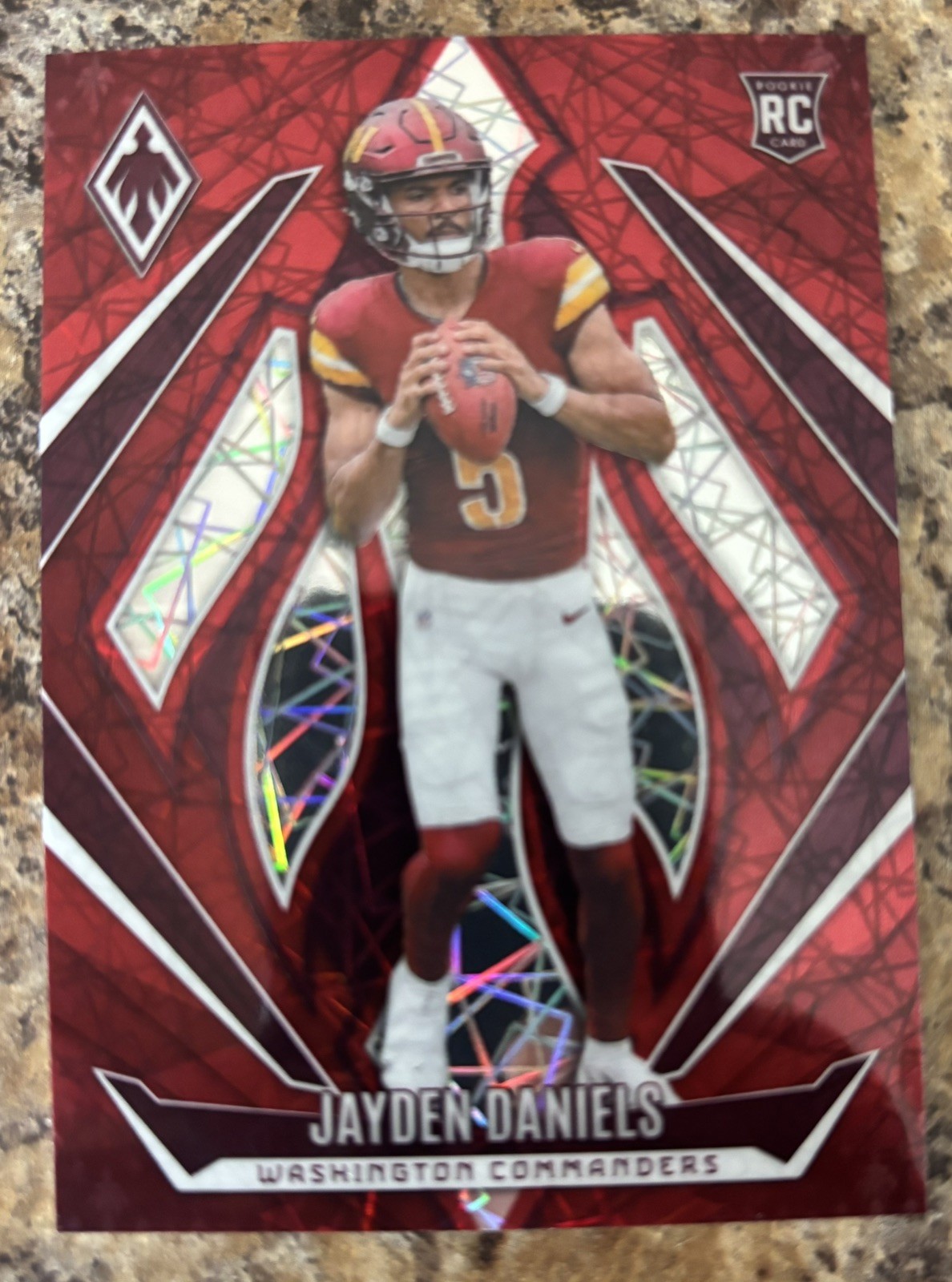 2024 Panini Phoenix - Rookies Jayden Daniels #198 Red Lazer /199 (RC)