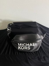 Michael Kors Sport Fanny Pack or crossbody with a prominent white "Michael Kors"