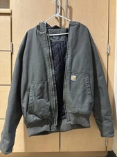 New Medium Carhartt Jacket. Without tags never been worn. Quilt Lined Moss Green