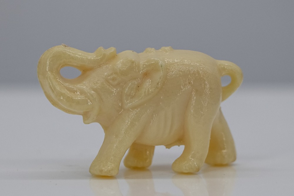 VTG Miniature Elephant Figurine Plastic Beige Raised Trunk 2” Long x 1-1/4” Tall