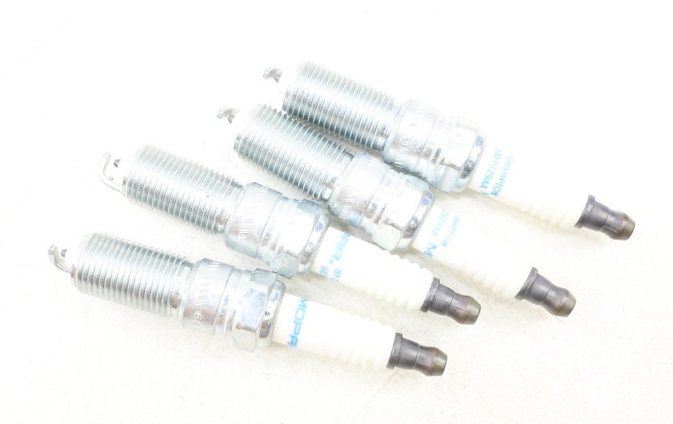 NEW OEM Mopar Spark Plugs Set of 4 68303929AA Stratus Magnum Sebring 2.7 05-06