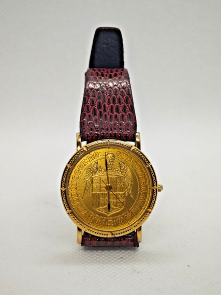 RELOJ DE PULSERA. ESFERA MONEDA REYES CATÓLICOS. CAJA CHAPADA EN ORO.