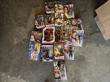 17 WWE Mattel action figures, 16 in boxes,sealed. Two rare. See item description