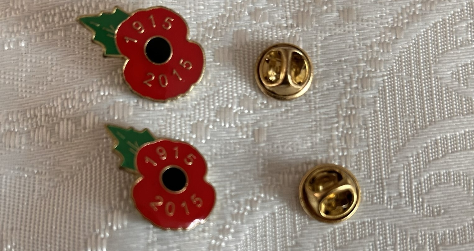 Two 2015 Year Remembrance Poppy Badges marking 100 years since World