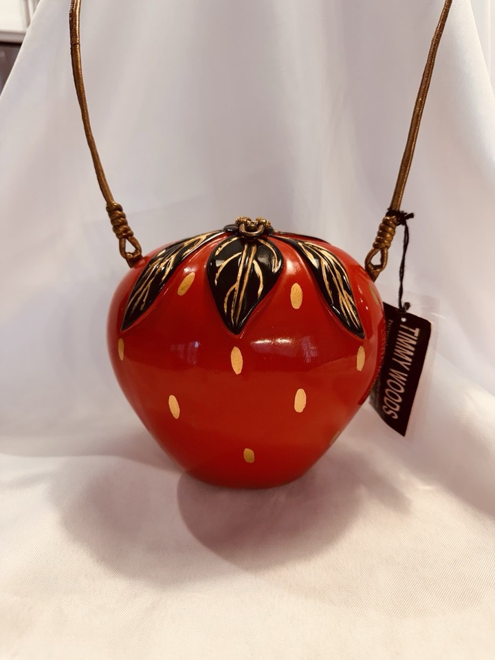 A genuine Timmy Woods hand-carved wooden strawberry purse — a collectible wearable sculpture that stops people in their tracks.