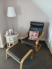 IKEA Poang Chair and matching footstool. Brown leather and oak veneer.