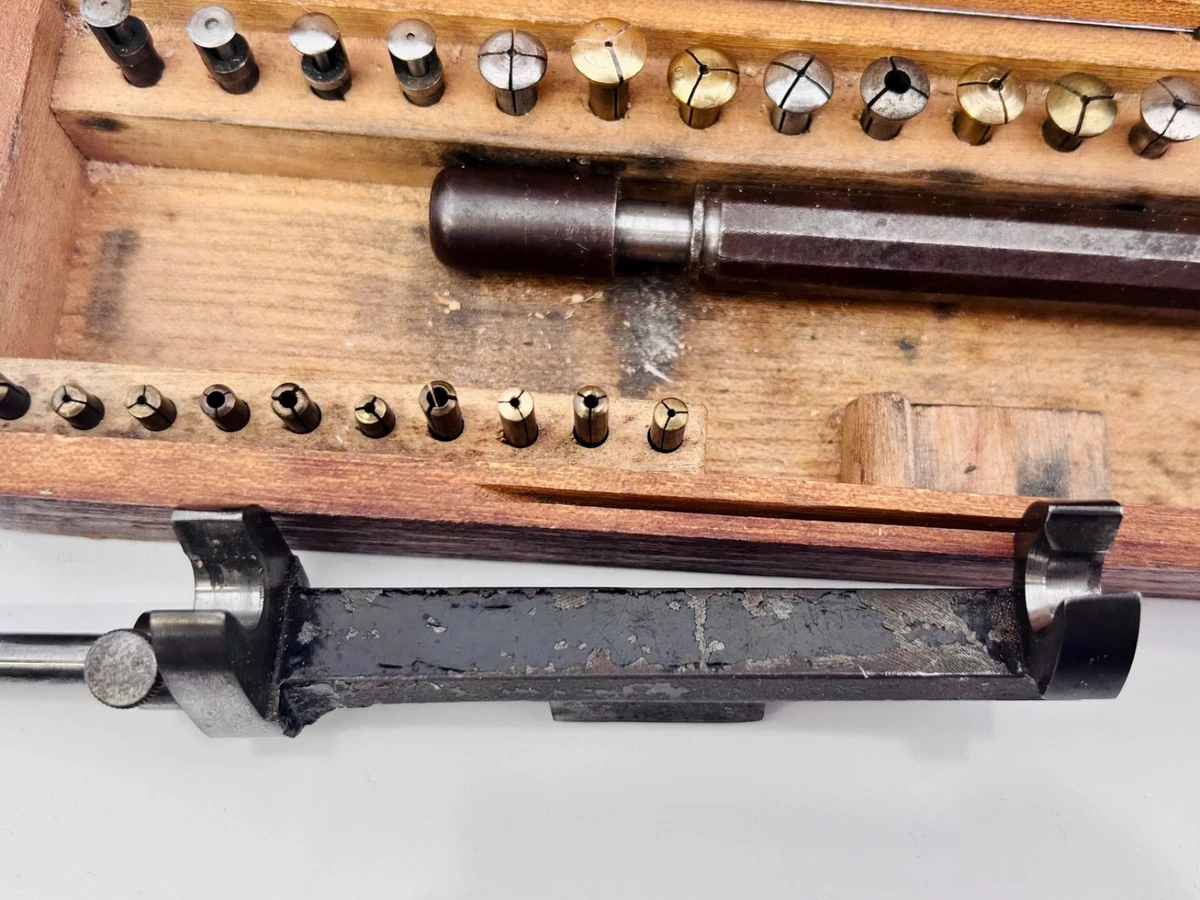 Watchmakers screw head polisher with collets in box.