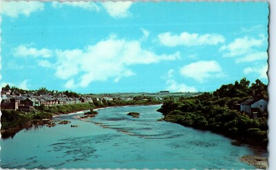 Potato Sheds on Banks of the Ardostook RIver Caibou Maine Postcard Posted 1969