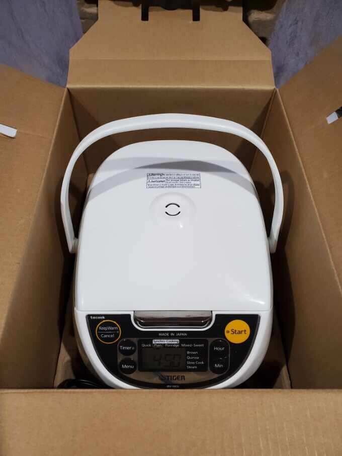 New Tiger 5.5 Cup Microcomputer Rice Cooker/Steamer/Slow New Tiger 5.5 Cup Microcomputer Rice Cooker/Steamer/Slow
