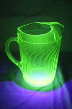 Large Vintage Uranium Green Glass Ribbed Wave Swirl Pitcher With Ice Lip