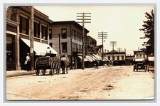 ODELL ILLINOIS RPPC ~ Main street view ~ Meat Market ~ Garage , Shops