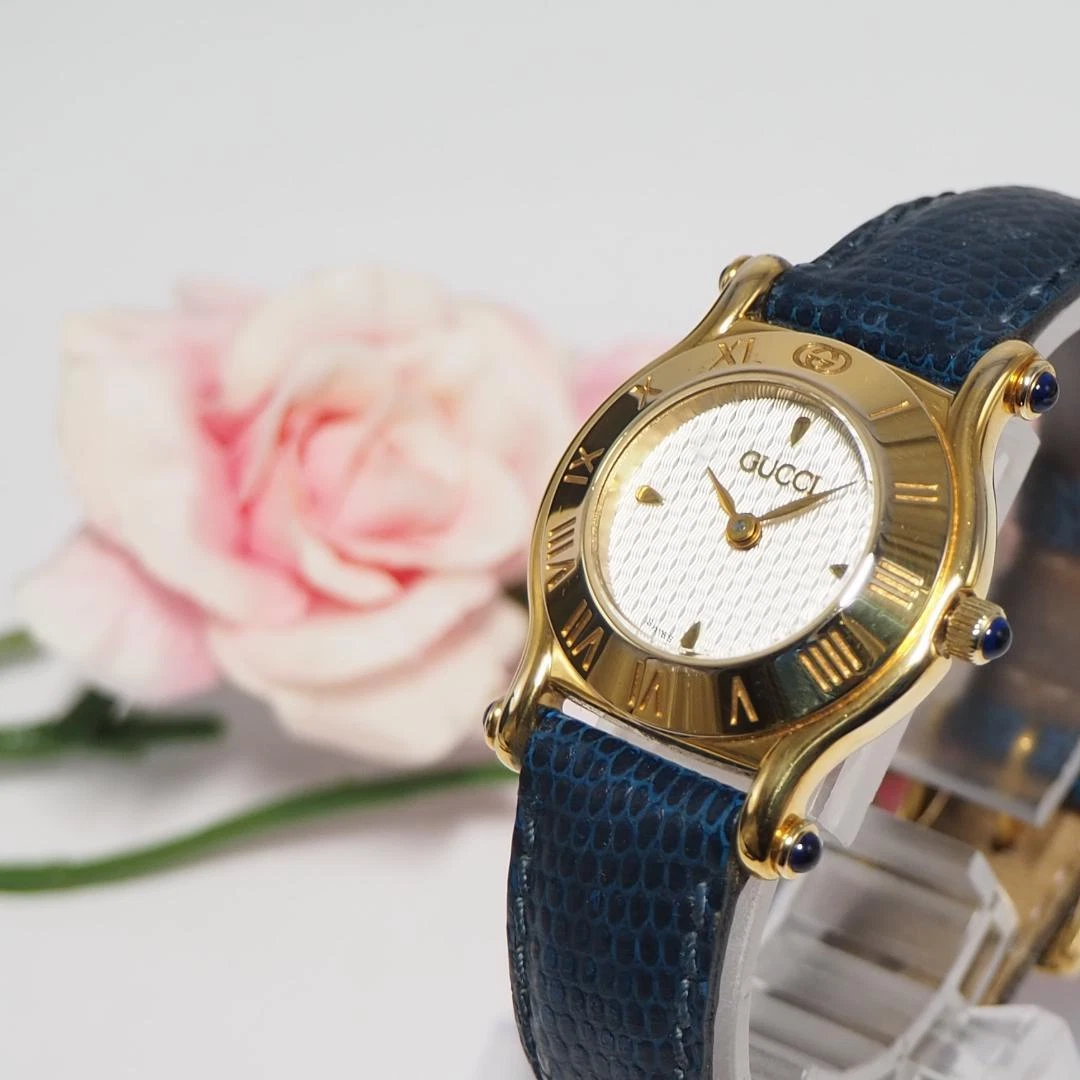 Montre femme Gucci ceinture cuir marine or F265