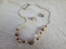 Tan necklace and earrings set.