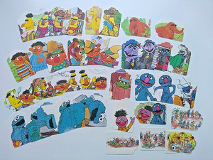 Lot of 38 Sesame Street Character Tags Punched from Children's Book