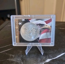 2012 $1 AMERICAN SILVER EAGLE .999 FINE SILVER IN A H.E. HARRIS & CO. HOLDER 