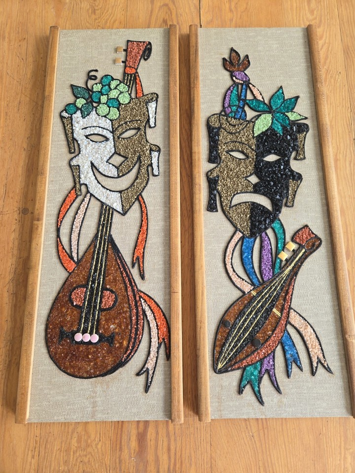 A matched set of Comedy & Tragedy framed gravel pebble art — a wildly specific mid-century folk craft that's genuinely bizarre and cool in the best possible way.