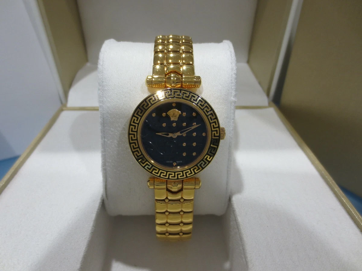 Reloj dorado esfera negra mujer sale