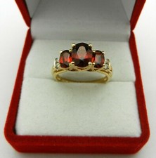 3Ct Oval Cut Red Garnet Three Stone Women's Engagement Ring 14K Gold Finish